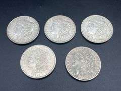 FIVE MORGAN SILVER DOLLARS
