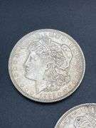 THREE MORGAN SILVER DOLLARS