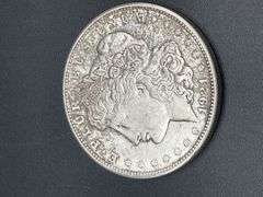 FIVE MORGAN SILVER DOLLARS