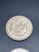 FIVE MORGAN SILVER DOLLARS