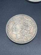 FIVE MORGAN SILVER DOLLARS