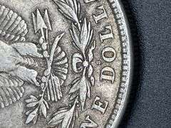FIVE MORGAN SILVER DOLLARS