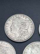 FIVE MORGAN SILVER DOLLARS