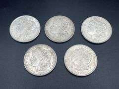 FIVE MORGAN SILVER DOLLARS