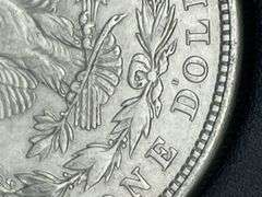 FIVE MORGAN SILVER DOLLARS