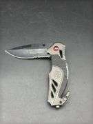 Three Pocket Knives: Smith & Wesson, Ozark Trail, and Tac-Force