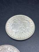 FIVE MORGAN SILVER DOLLARS