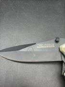 Three Pocket Knives: Smith & Wesson, Ozark Trail, and Tac-Force