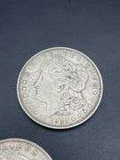 FIVE MORGAN SILVER DOLLARS