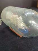 Bullet Casing Figurine, Ship in Bottle, & Musical Instruments