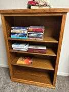 Wooden Bookcase with Books and Crochet