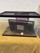 10 GALLON AQUARIUM, BAG OF POTTING SOIL, FUNNEL, AND LID