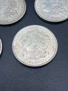 FIVE MORGAN SILVER DOLLARS