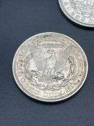 THREE MORGAN SILVER DOLLARS