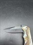 Three Pocket Knives: Smith & Wesson, Ozark Trail, and Tac-Force