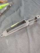 Assorted Rifle Parts: Triggers, Housing, and Magazine Release