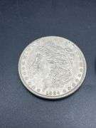 THREE MORGAN SILVER DOLLARS