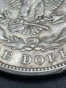 FIVE MORGAN SILVER DOLLARS