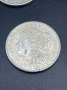 FIVE MORGAN SILVER DOLLARS