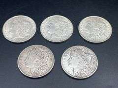 FIVE MORGAN SILVER DOLLARS