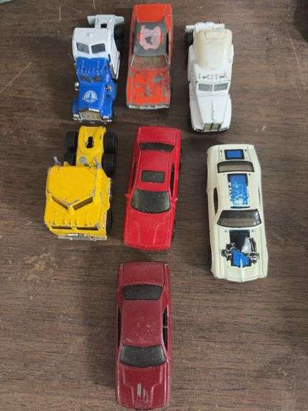 7 old toy cars and trucks image