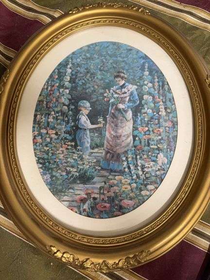 OVAL SHAPED PICTURE OF A MOTHER AND SON PICKING FLOWERS image