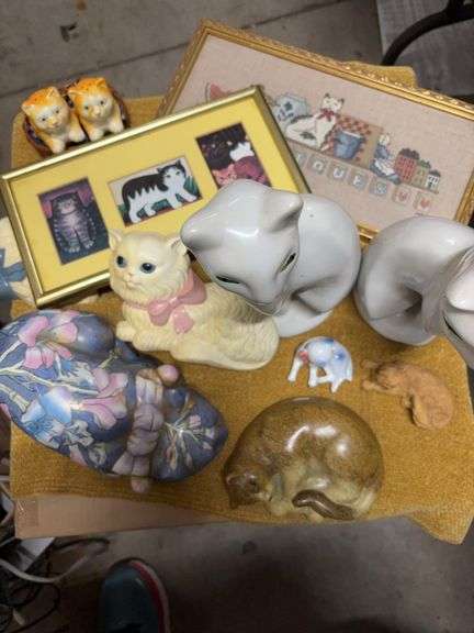 BASKET OF CATS.  SOME HAVE BEEN BROKEN AND GLUED image