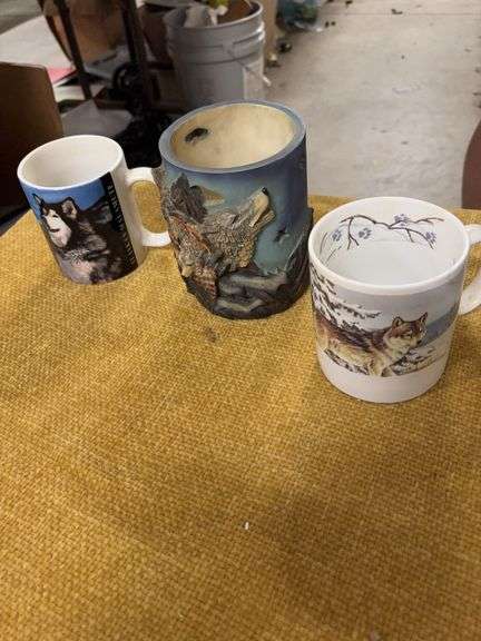 TWO WOLF CUPS AND A CANDLE LIGHT image