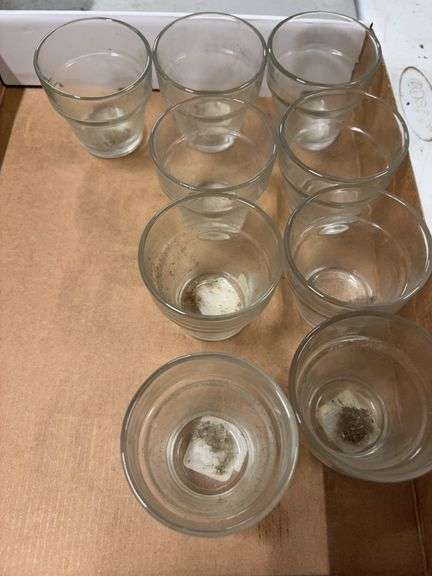 NINE SMALL GLASS FLOWER POTS. image
