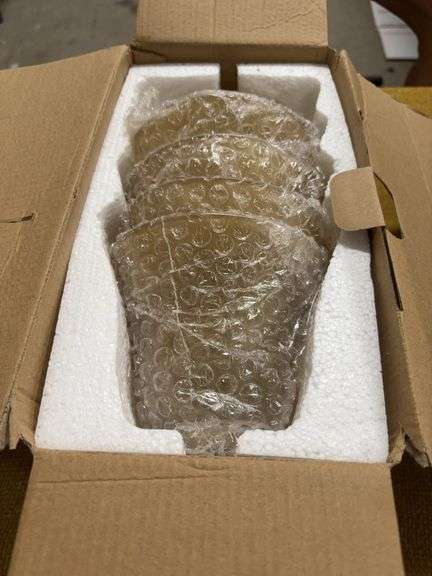 NEW IN BOX FOUR LIGHT GLOBES.  AMBER FROSTED IN COLOR image