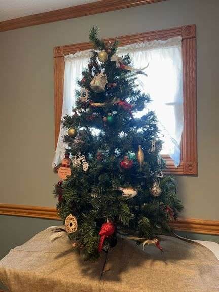 Decorated Christmas Tree with Ornaments and Tree Skirt image