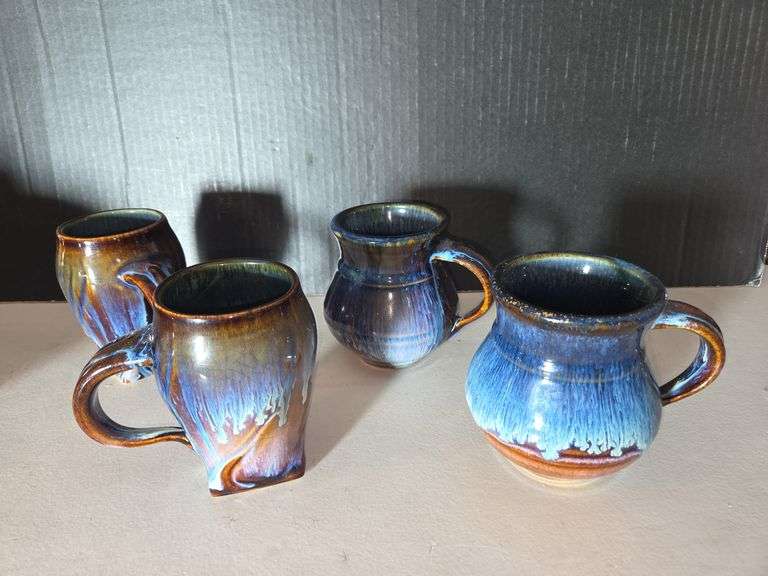 Set of Four Handcrafted Pottery Mugs with Blue Glaze image