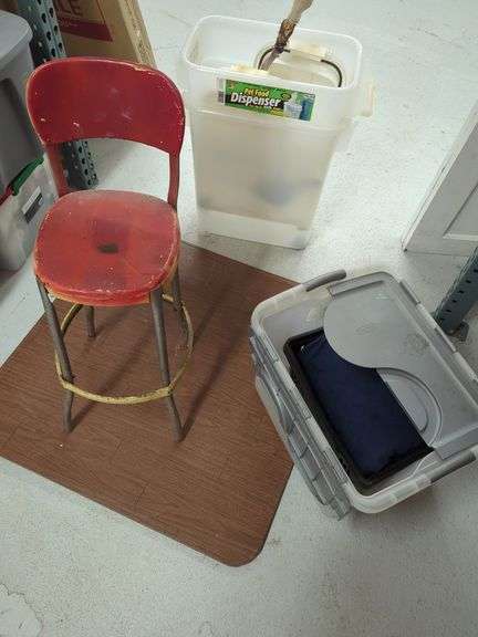 Assorted Household Items: Red Metal Chair, Pet Food Dispenser, Blanket in Storage Container image