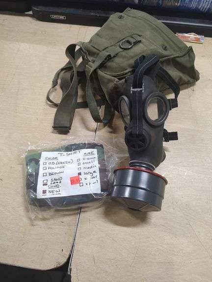 GAS MASK AND LARGE CAMO SHIRT image