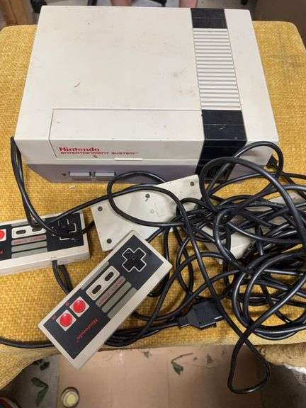 VINTAGE NINTENDO ENTERTAINMENT SYSTEM.  FOUR CONTROLLERS image