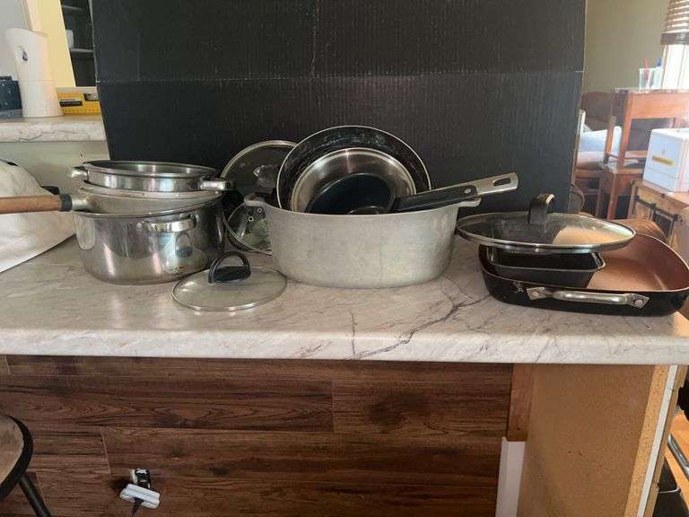 Collection of Used Pots, Pans, and Baking Dishes image