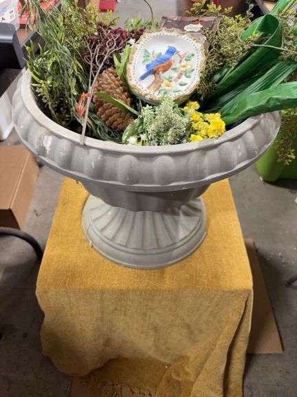 PLASTIC FLOWER POT WITH SOME DAMAGE.  FILLED WITH ARTIFICIAL FLOWERS. image
