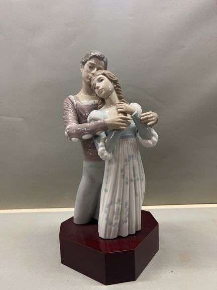 Porcelain Figurine of Embracing Couple on Wooden Base image