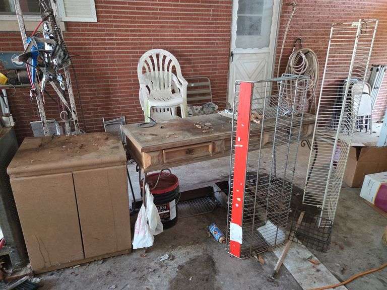 Workbench with Cabinet, Shelf Rack, Paint Bucket and Various Items image