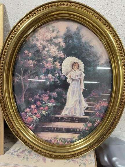 BEAUTIFUL OVAL SHAPED PICTURE OF A WOMAN IN FLOWERS. image