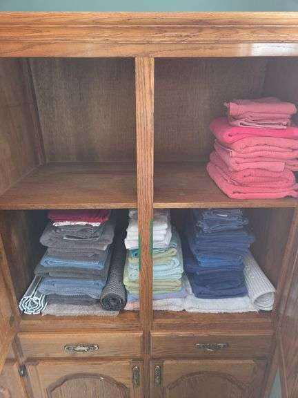 Variety of Towels and Shelf Organizers image