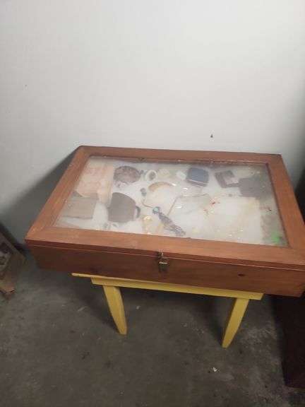 Table and display case with Collectibles: Advertising, Jewelry, and More image