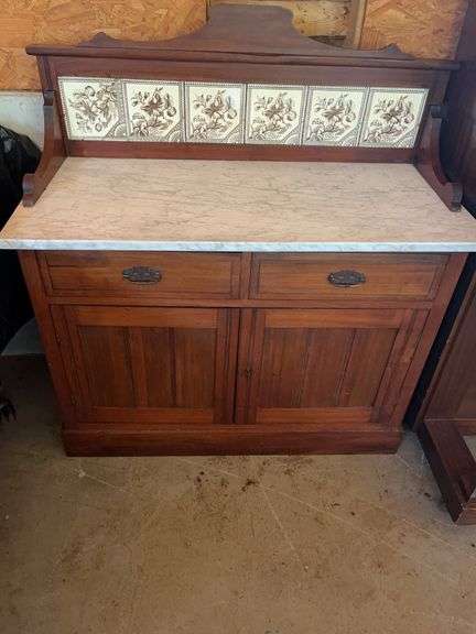 Wooden Cabinet with Marble Top and Tile Backsplash image