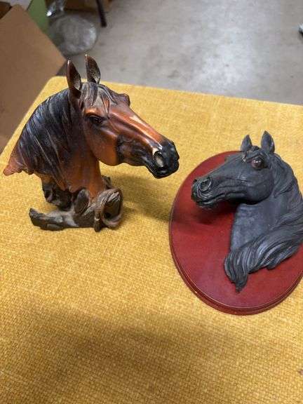 TWO HORSE HEAD STATUES image
