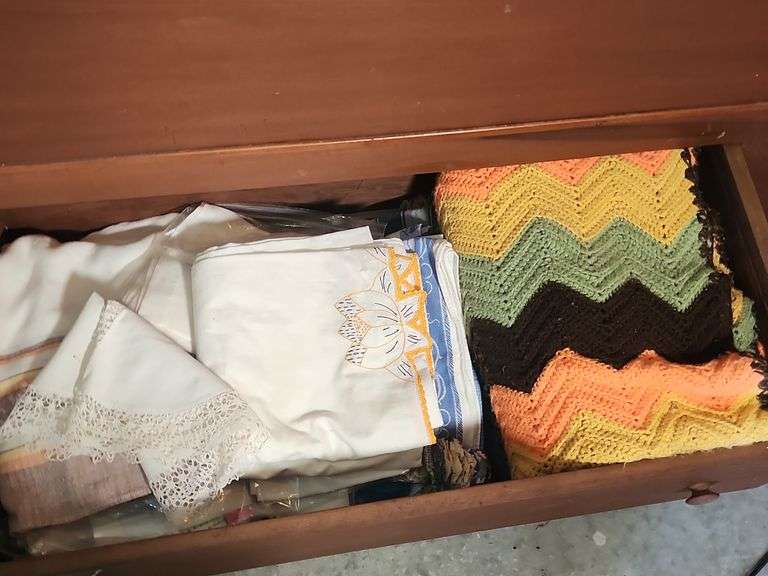 Linens including Crochet Blanket, Sheets, and Pillowcases image