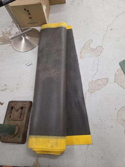 Two Rolls of Black Rubber Material with Yellow Edges image