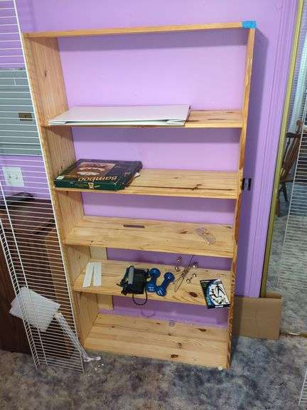 Wood Shelving Unit with Various Items image