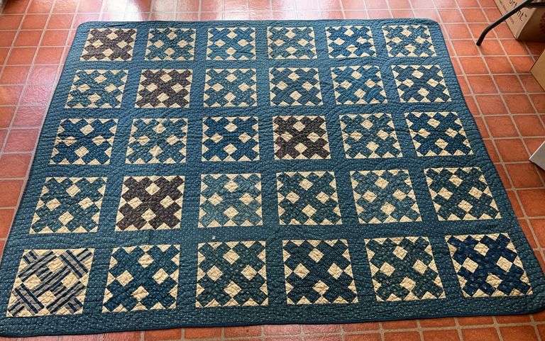 Blue and Tan Quilted Blanket image