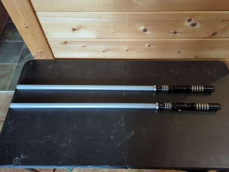 Two Black and Silver Lightsaber Props image