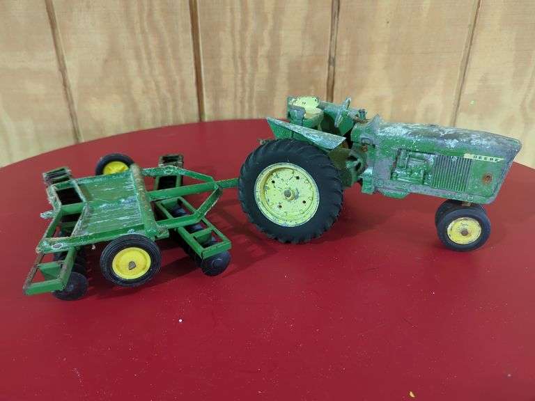 The ERTL Co. John Deere 4020 Toy Tractor with Disc